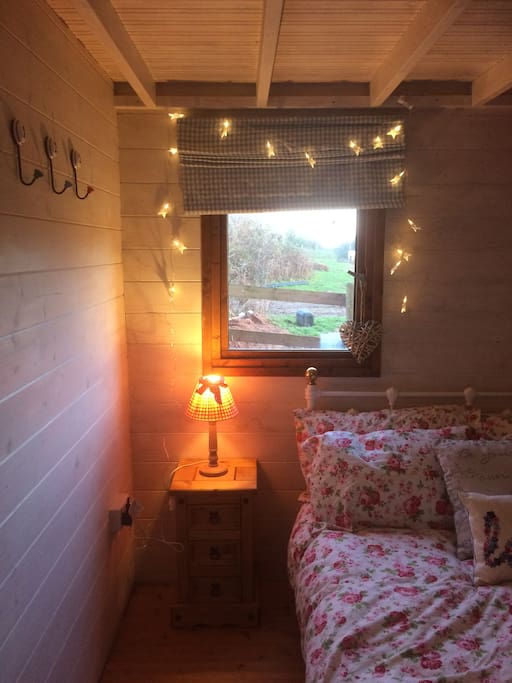 Pretty cosy bedroom with electric heater and electric blanket.