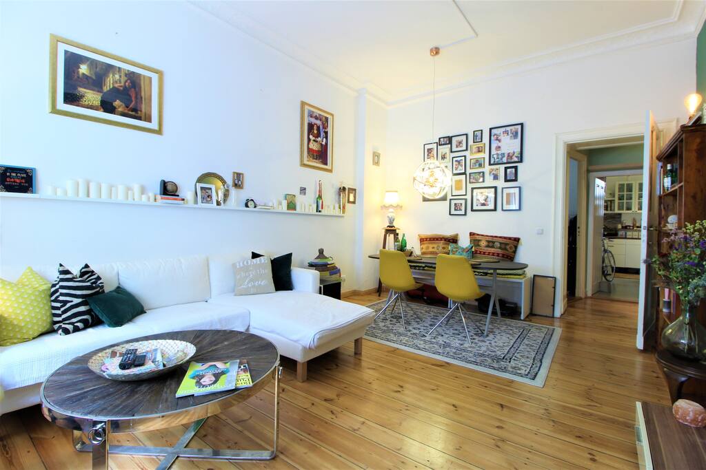 The spacious living room has stylish furniture & creates an inviting atmosphere.