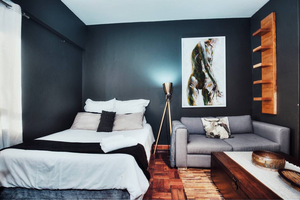 View of the bed and lounge area.