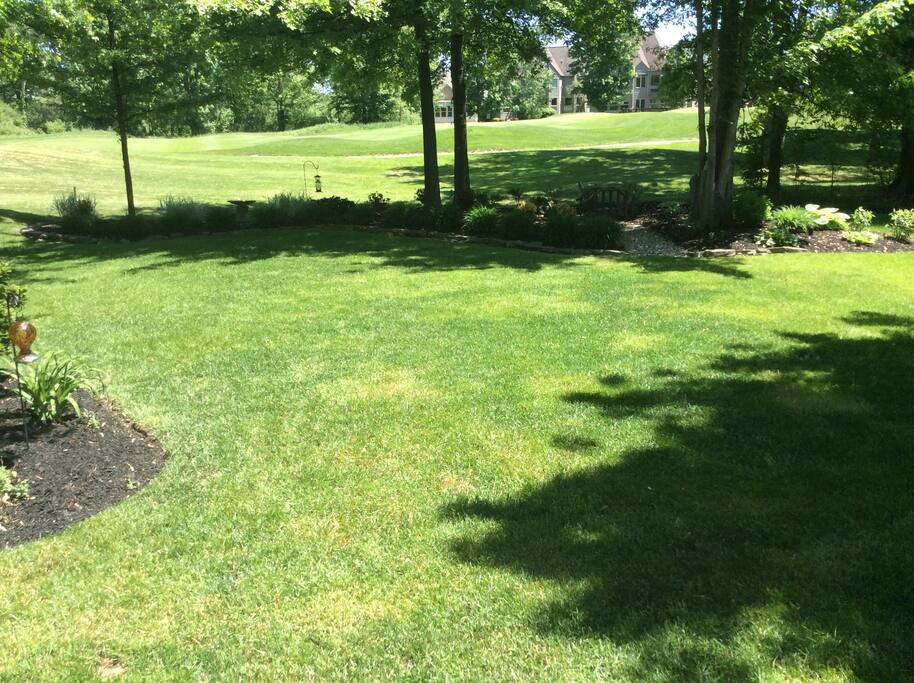 large yard with golf course view