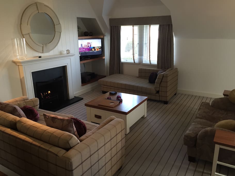 Spacious living area - real flame gas fire, TV integrated sound system.