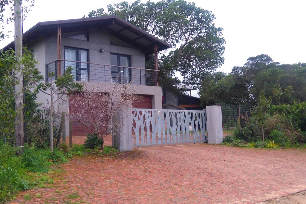 Property entrance showing guest apartment above garage.