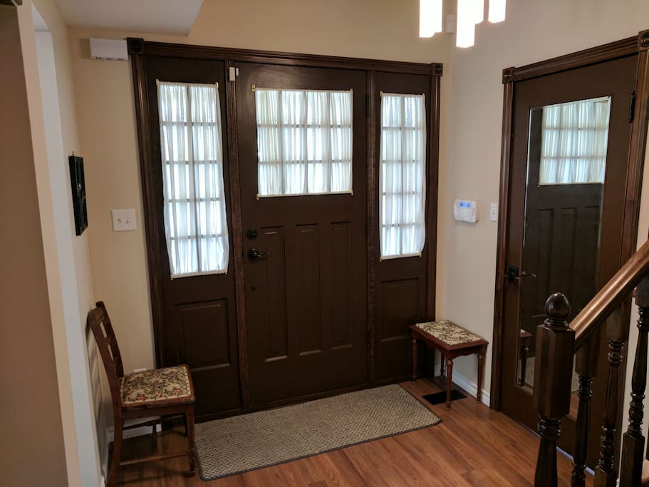Front entrance with powder room to your left