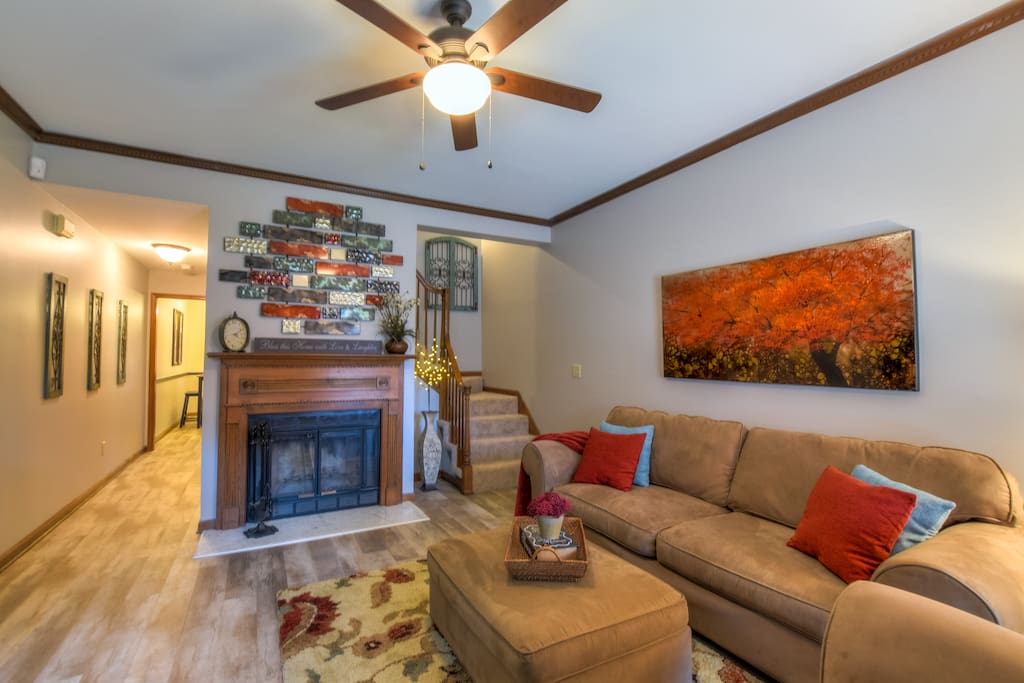 Living room area with wood burning fireplace - perfect on those chilly nights.