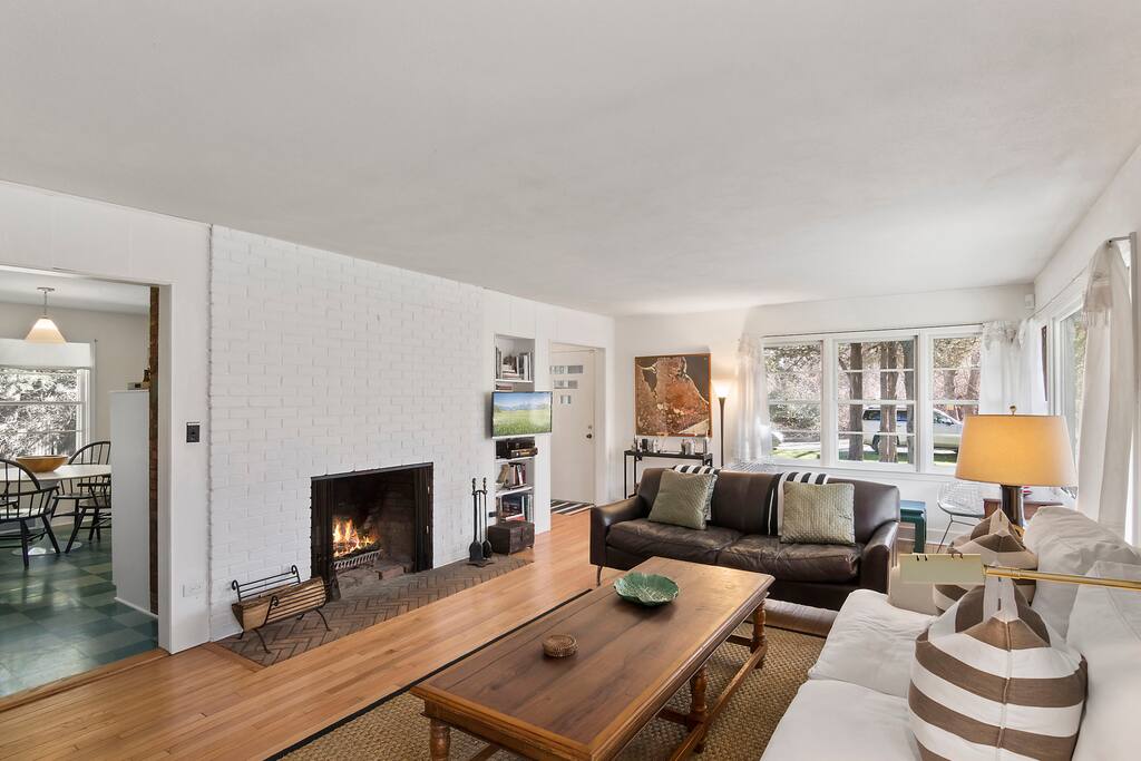 High-speed wireless, TV, phone... wood burning fireplace... relax in open, inviting living room.