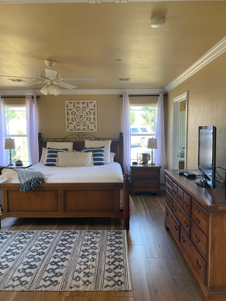 We welcome you to the Master suite fit for a king or queen with adjoining En-suite.  The en-suite offers his and her sinks, awesome walkin shower and then relax in our wonderful jacuzzi tub for two.  For those extended stayers, a huge walk-in closet.