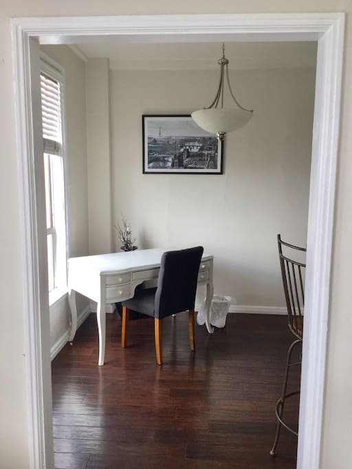 Writing nook, kitchen, and dining area are separate from the bedroom.