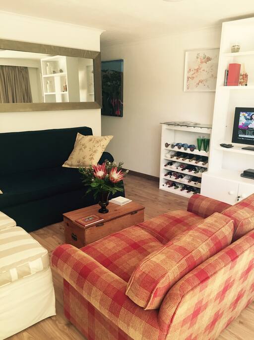 Cozy sofas allow for you to relax and watch cable TV.