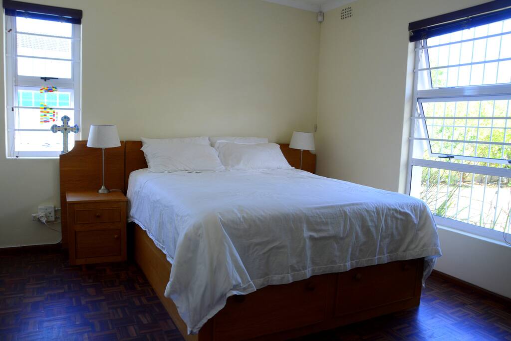 Master bedroom with queen size bed (extra length) and built in cupboards