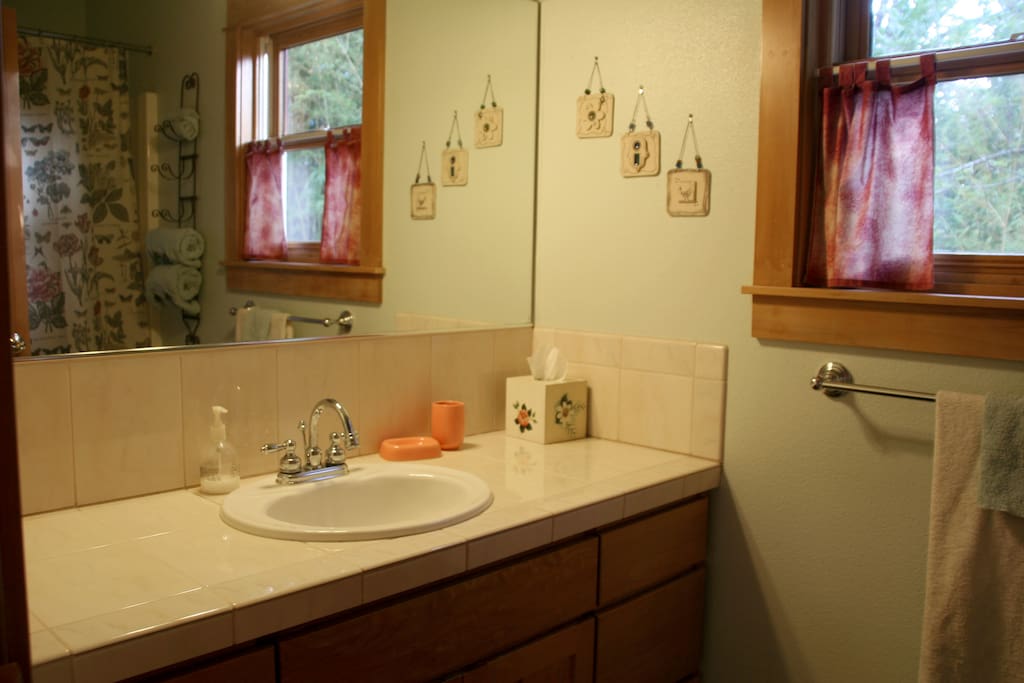 Private bath with tub/shower adjacent to bedroom.