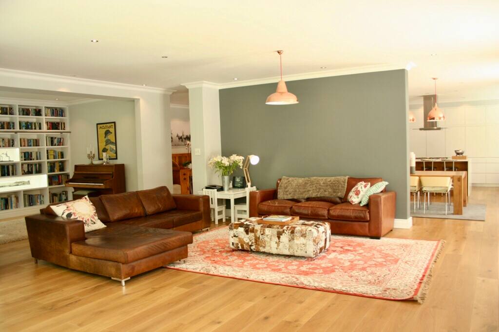 Open plan lounge linking to the dining room, kitchen, library, play area and patio