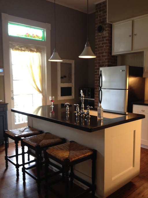 Kitchen is fully furnished with an island and bar stools! Wine fridge and cooler size ice maker.