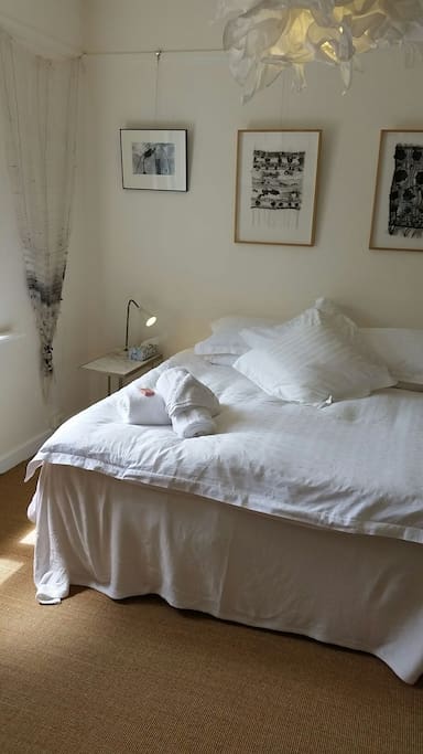 Light and north facing guestroom. Please ask whether you require a queen or two singles instead? An added mattress on the floor?