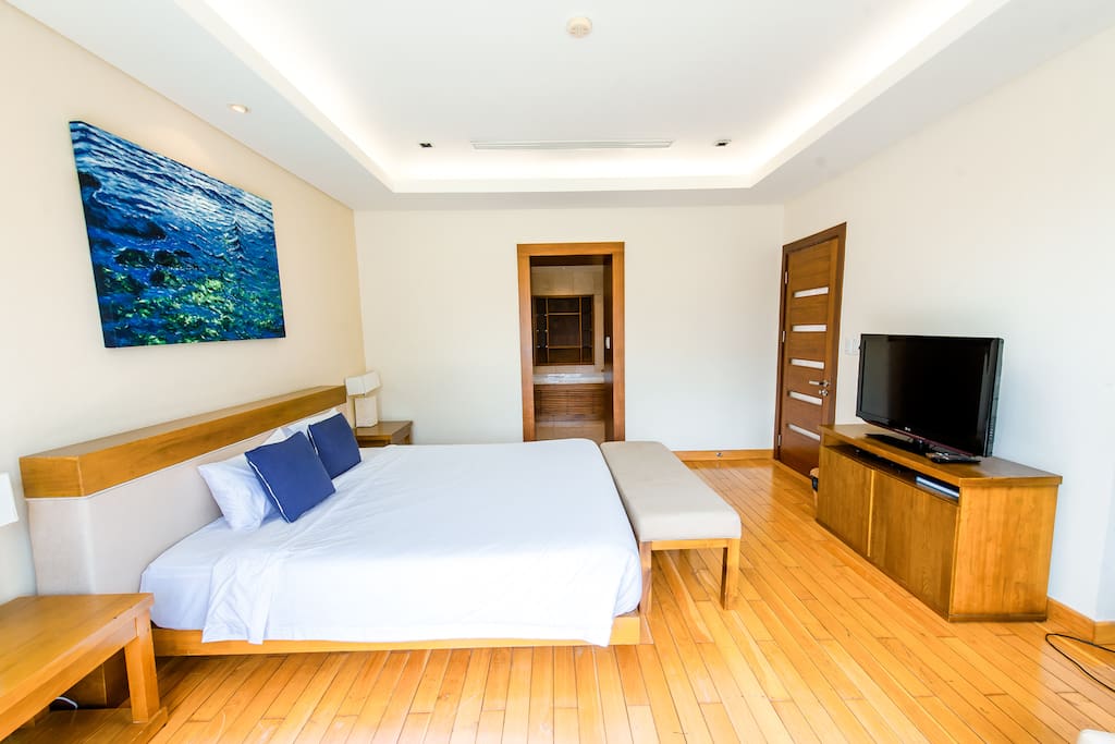 Bedroom # 1 on the second floor. Spacious oasis, with balcony to view the garden space in the back.