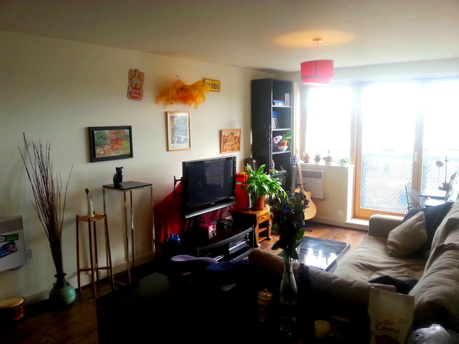 The living area, very comfortable sofa, TV with freeview, with a desk space by the window