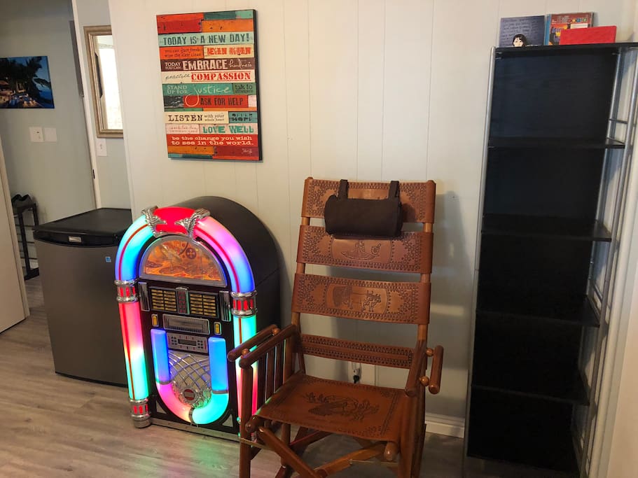 4.5 ft.³ fridge a real working jukebox with radio and CD a folding leather rocking chair and lots of storage space and a Bluetooth speaker