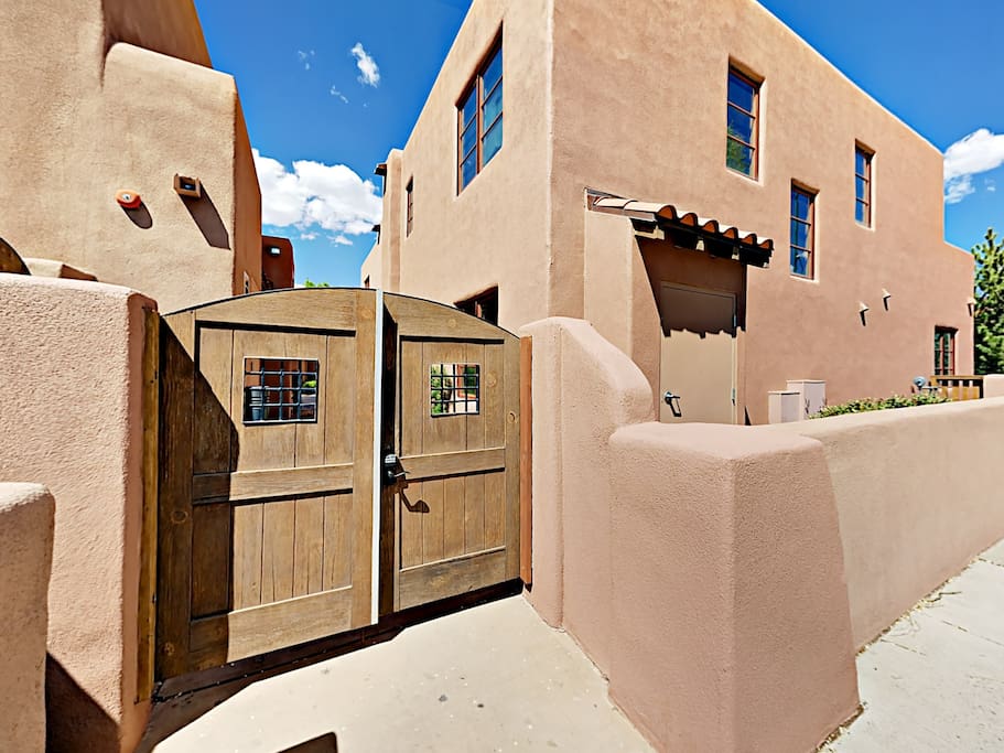Nestled in an exclusive gated enclave, this 2BR/2BA condo with traditional Santa Fe Pueblo architecture is located just a few blocks from downtown.