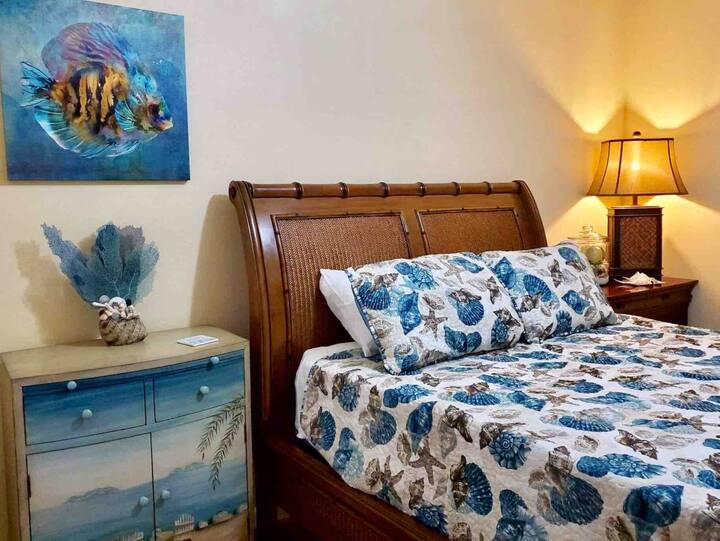 The Queen room includes dresser space and a full closet.  Extra towels and linens are provided in the decorative side cabinet.    Our Tommy Bahama style bed features a new mattress with gel topper and 100% cotton sheets.
