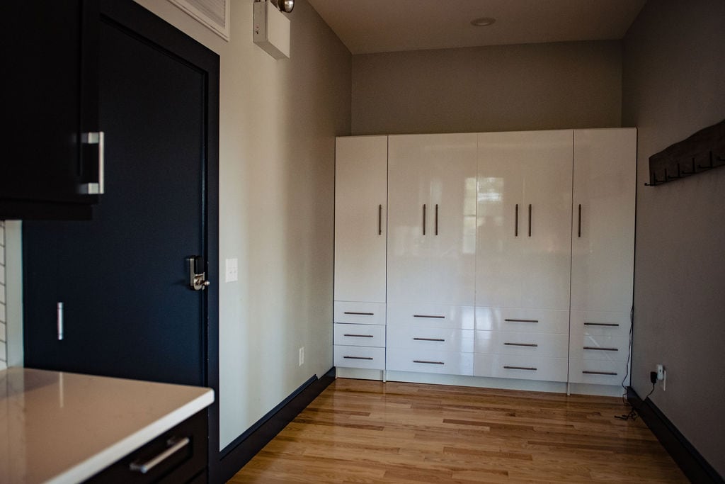 Murphy bed to the left of the entrance door.