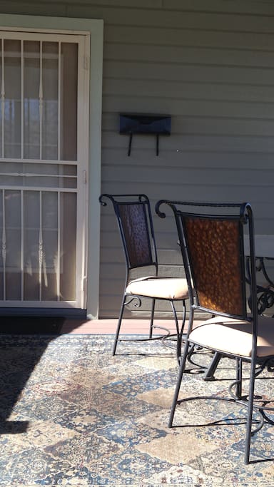 Deck entrance with 4 chairs and glass table, 2 chairs to enjoy cool morn., eve., days.