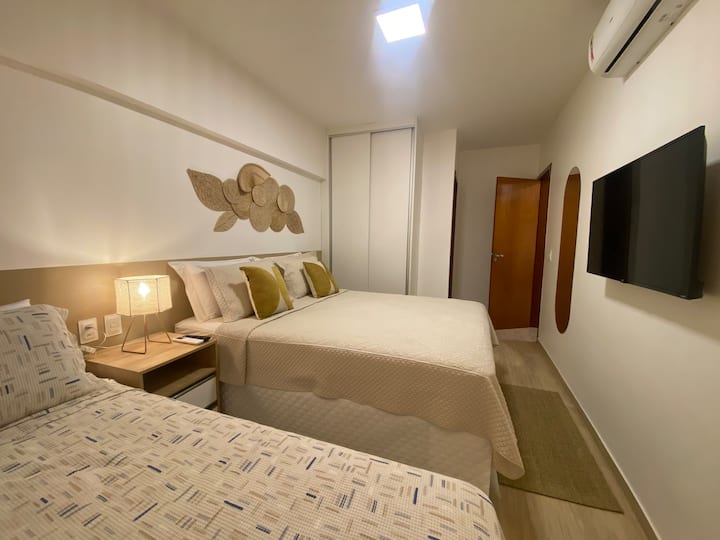 BEACH suite consisting of a queen bed and a double bed.