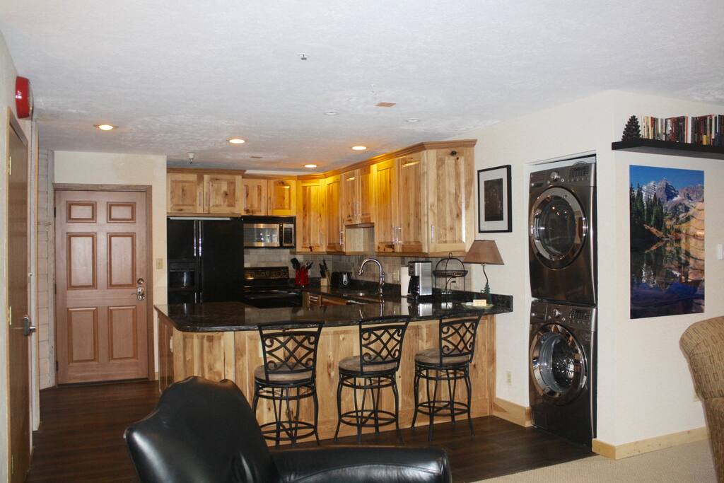 Newly enlarged and updated kitchen with full size washer/dryer.