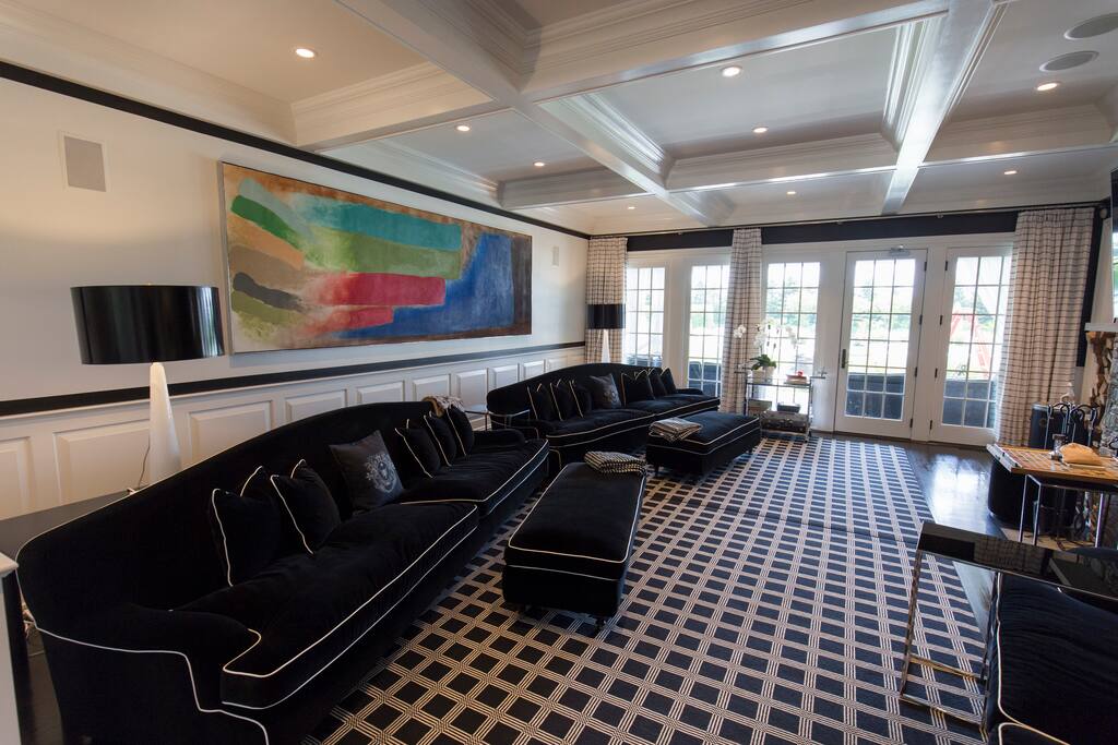 Living Room w/ 3 Massive Couches + 75" 4K TV & Real Wood-Burning Fireplace