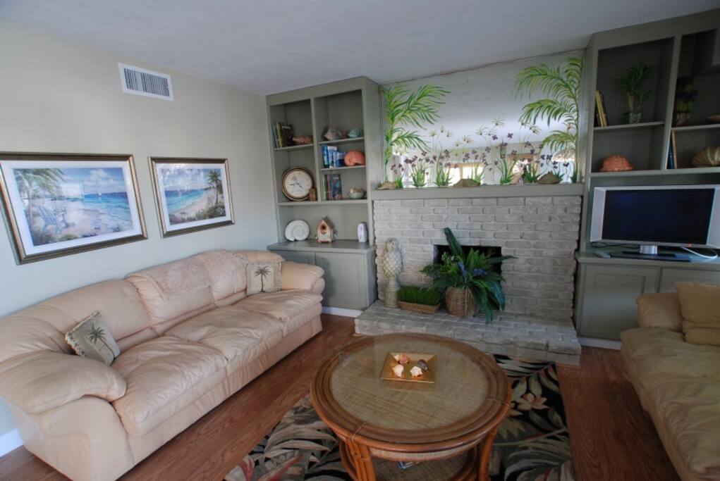 Large Living Area with fireplace and flat panel TV.