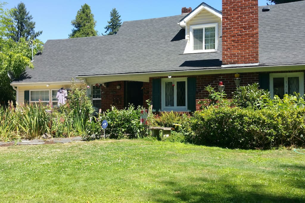 1938 cottage sits on 3/4 acre, provides a feeling of country cabin in the garden.