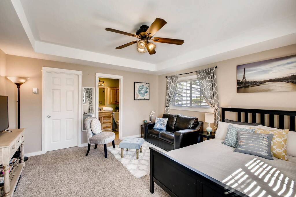 View of the main room showing the queen bed and sitting area.