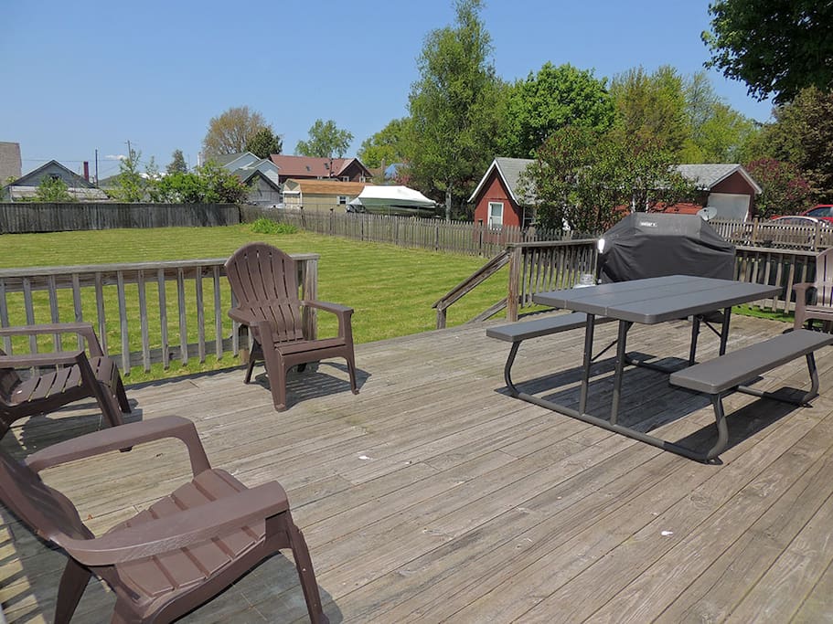 Large backyard deck with picnic table, gas grill and Adirondack chairs to sit back and enjoy your time away from home. Off the deck is the oversized fenced in backyard -great for yard games and family time.