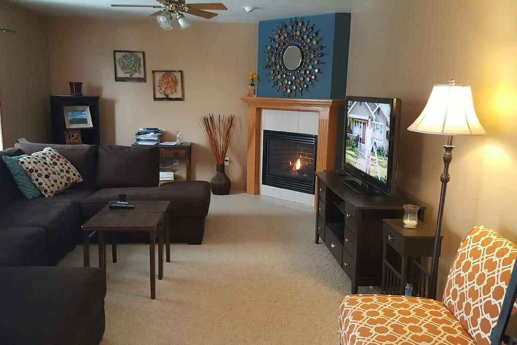 Living room with sectional couch and fireplace