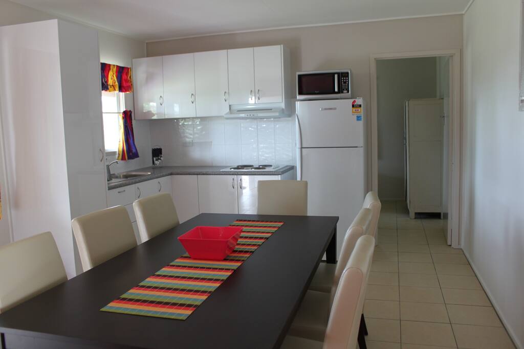 The kitchen and bedroom adjacent.