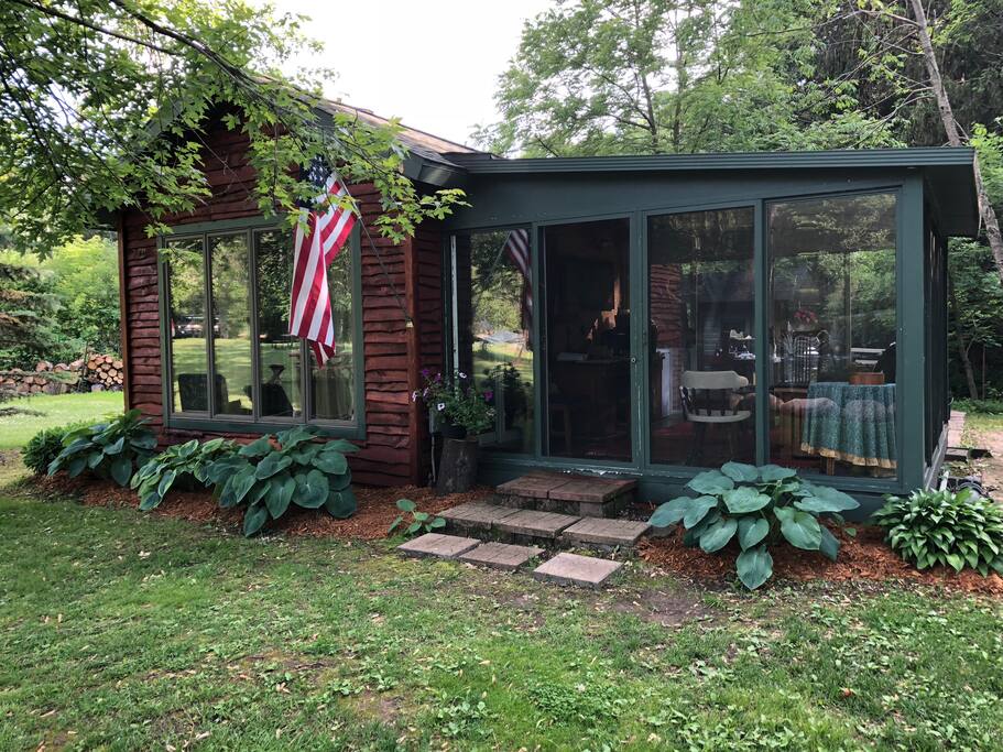 Full frontal view of the cabin and porch
