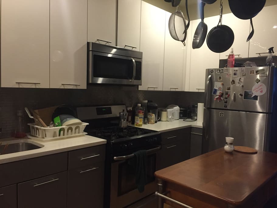Modern appliances and a lot of pots and pans