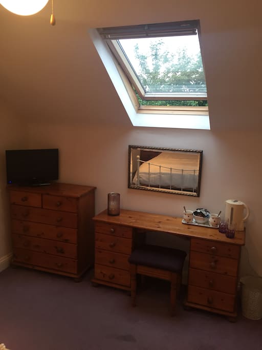 Skylight, dressing table and TV
