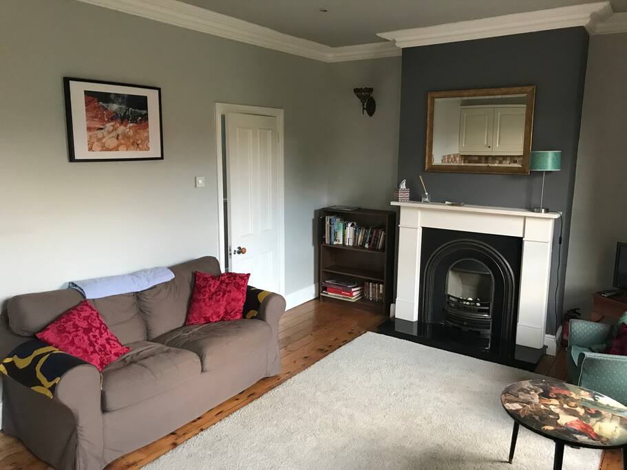 Living room and kitchenette complete with dining table, couch, WiFi, TV etc...
