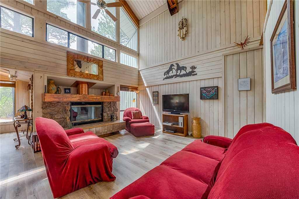 Living Area - From the large, elegant windows, you and your guests will love spending time together in this bright and airy livin