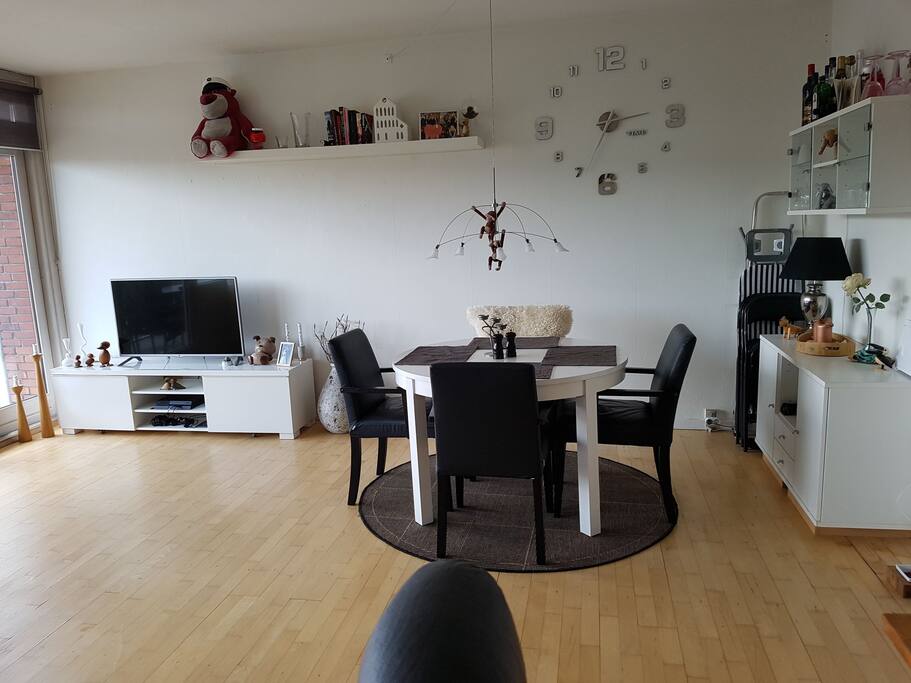 Living room with dining table and TV