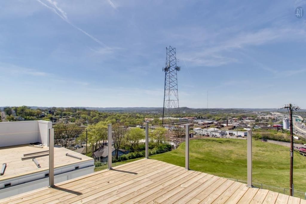 This house has two roof top decks. One overlooks the country side and the other overlooks the city side.