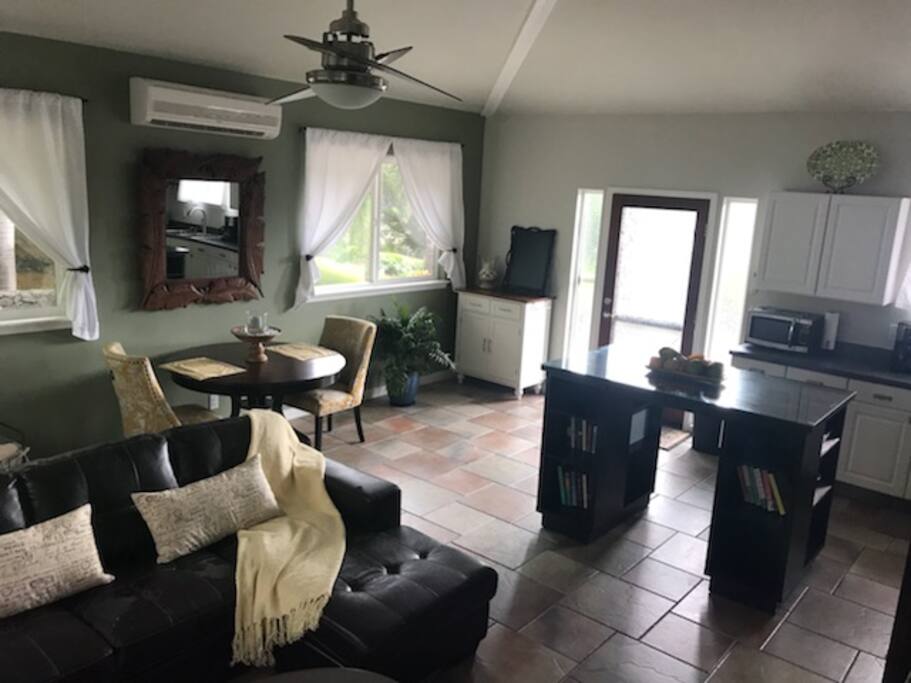 View of the dining table with the kitchen on the right.