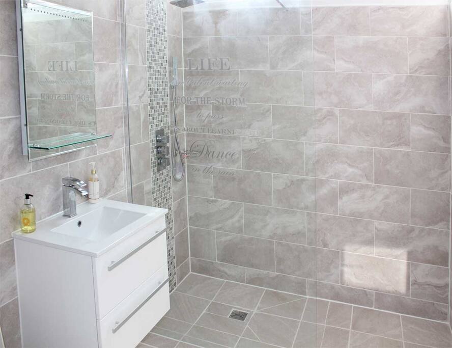 The bathroom with walk in shower