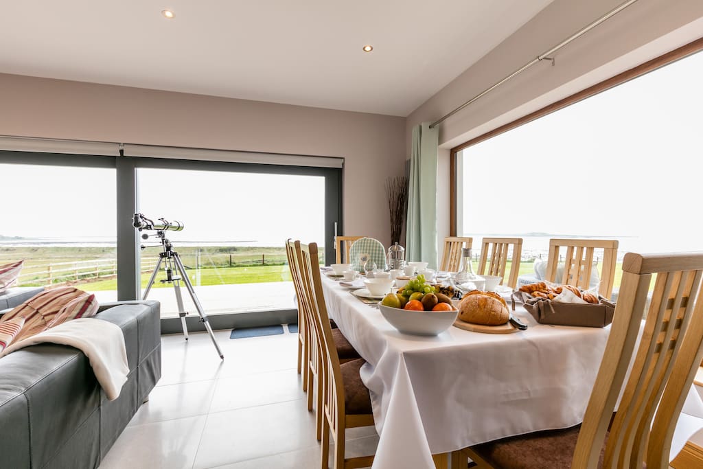 Getting ready for breakfast in the sun lounge. try out the telescope to see what you can spot across the lough.