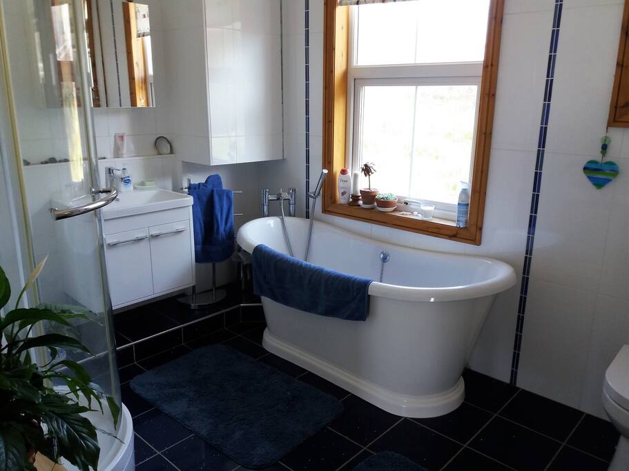 Spacious with separate shower cubicle.
