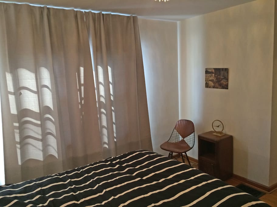 Bedroom with vintage Charles Eames "bikini" chair