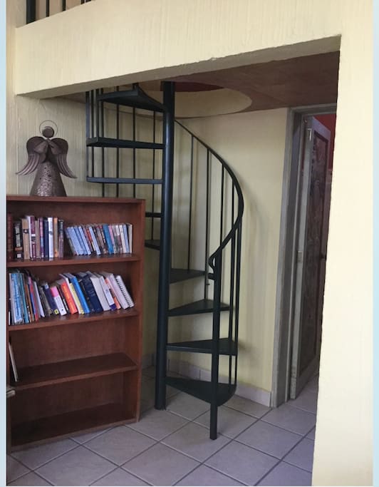 We are filling the bookcase with books, spiral stairs leading to loft bedroom with twin beds. The condo has games, cd and a tv.