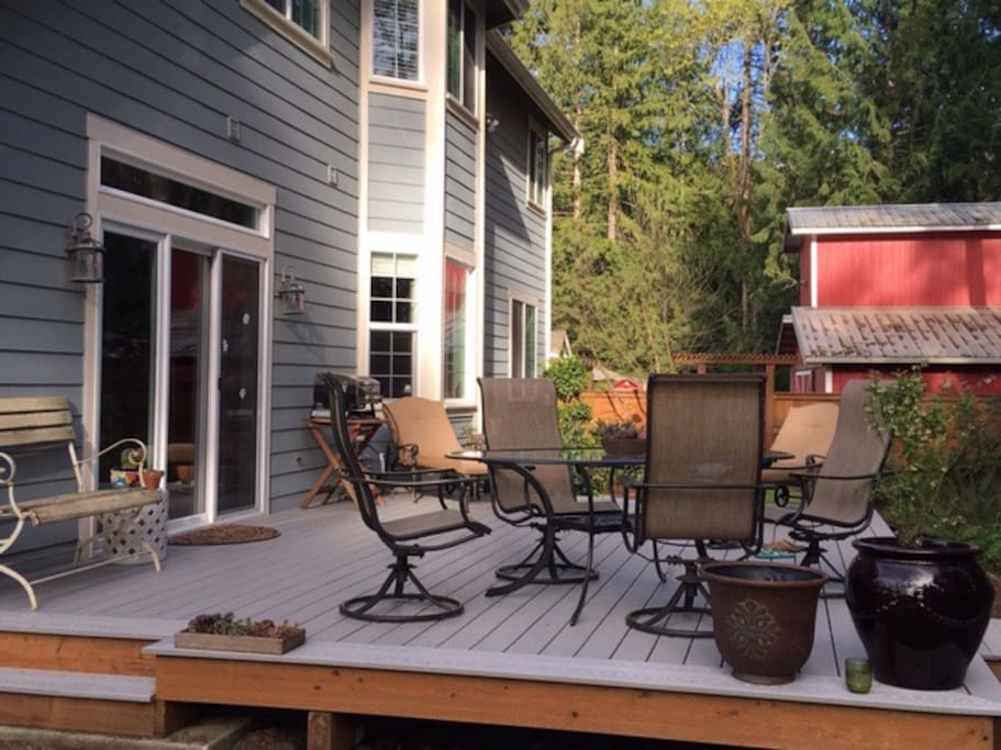 Deck off back with patio table and loungers