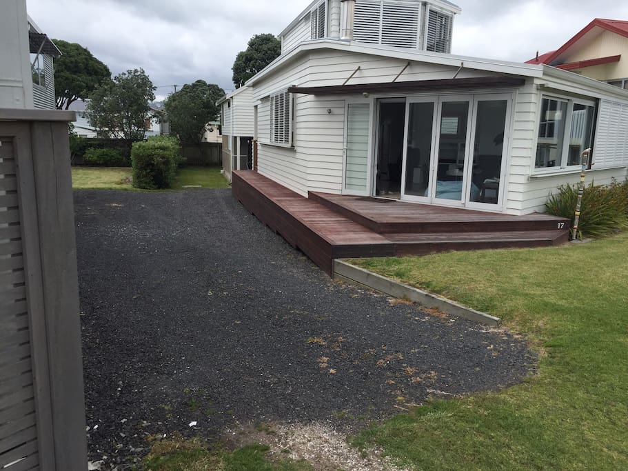 View of the main house at 17 Hinemoa Rd with garage and apartment down the driveway on right