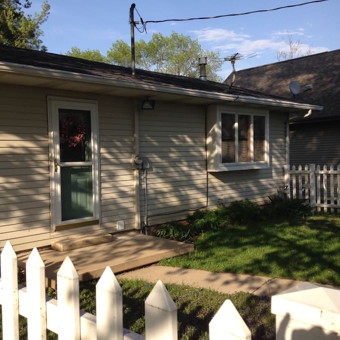 Back door and small fenced yard