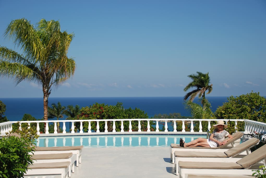 Relaxing by the pool, just steps away from the house